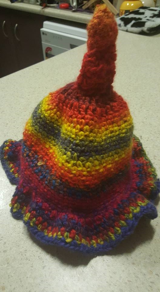 very bad crocheted cap with a strange bobble on the top